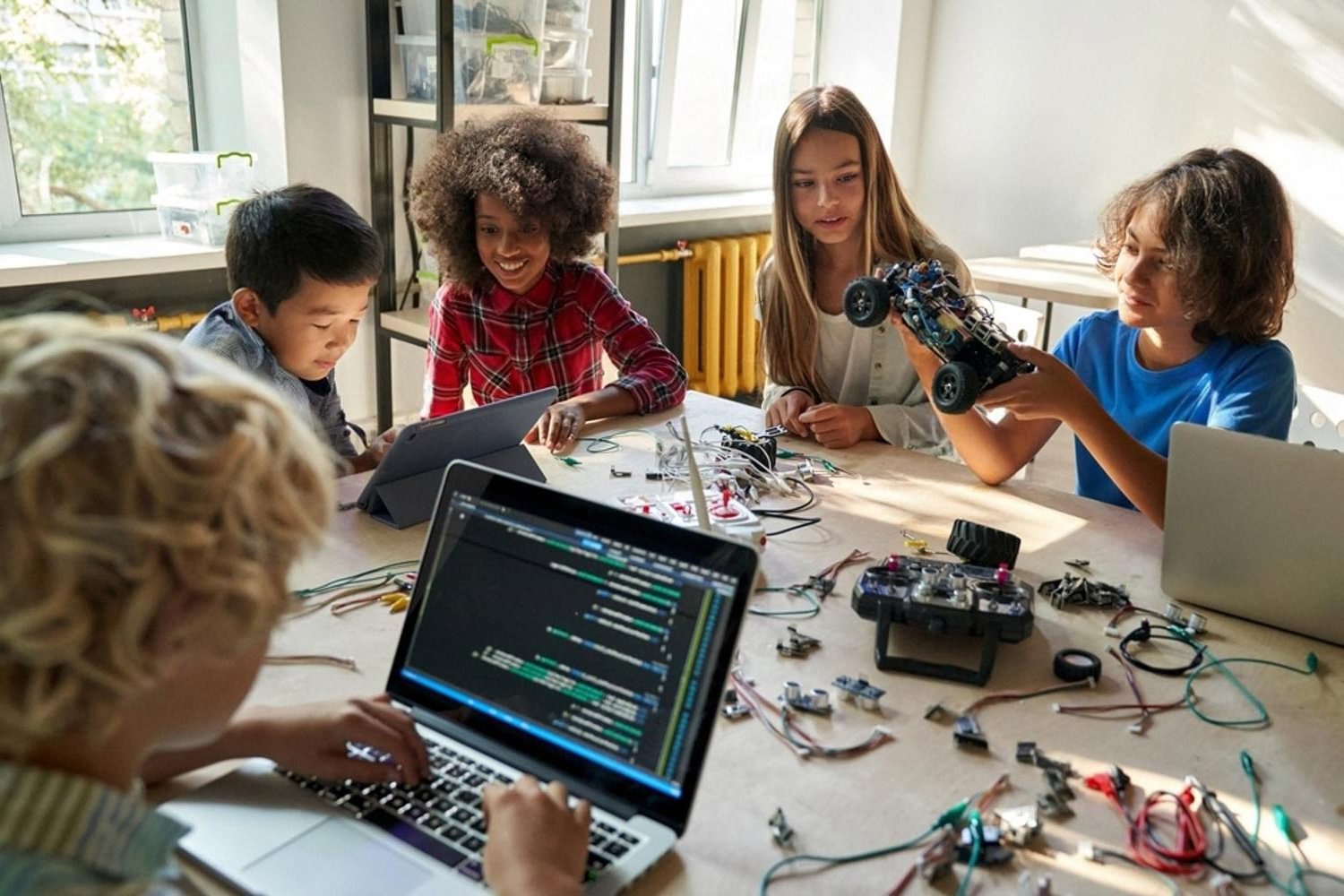 Group of students working on a robotics and coding project during a CBSE co-curricular session